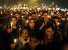 Protesters hold candles during a rally in New Delhi late Saturday following the death of a woman gang-raped on a bus. Protesters hold candles during a rally in New Delhi late Saturday following the death of a woman gang-raped on a bus.