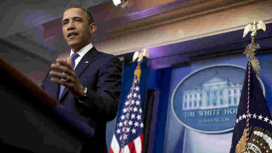 President Barack Obama gestures during a statement on the fiscal cliff negotiations with congressional leaders in the briefing room of the White House on Friday in Washington.