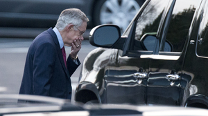 Senate Majority Leader Harry Reid of Nevada leaves the White House after a closed-door meeting with the president and congressional leaders.