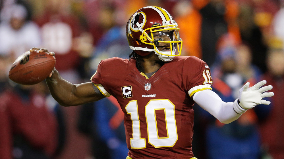 Robert Griffin III of the Washington Redskins looks to pass against the Dallas Cowboys in the second quarter on Sunday in Landover, Md. Robert Griffin III of the Washington Redskins looks to pass against the Dallas Cowboys in the second quarter on Sunday in Landover, Md.