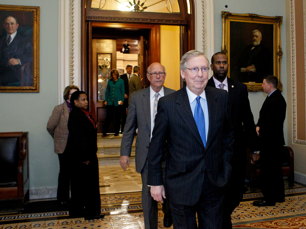 Senate Minority Leader Mitch McConnell, R-KY, leaves the Senate chamber to caucus in the Capitol on Sunday.