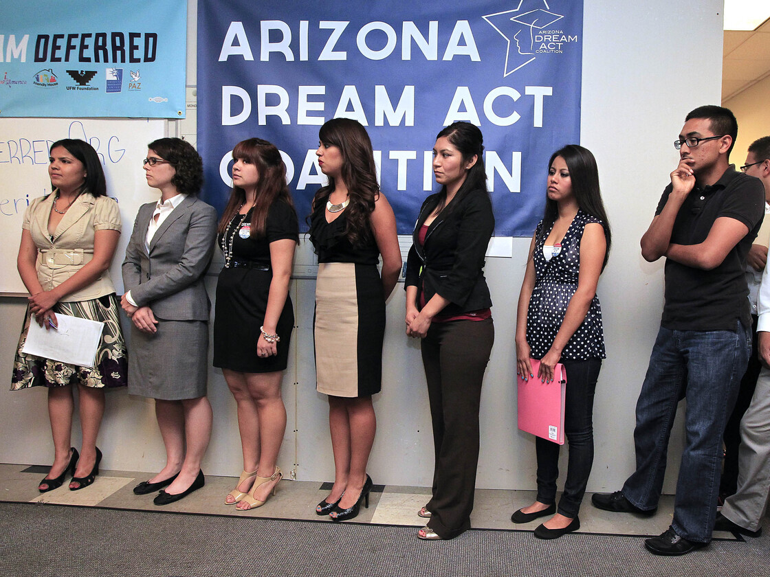 Arizona DREAM Act Coalition staff members, other advocacy group representatives and young immigrants line up in Phoenix last August for guidance about the federal program called Deferred Action, that would help illegal immigrants avoid deportation.