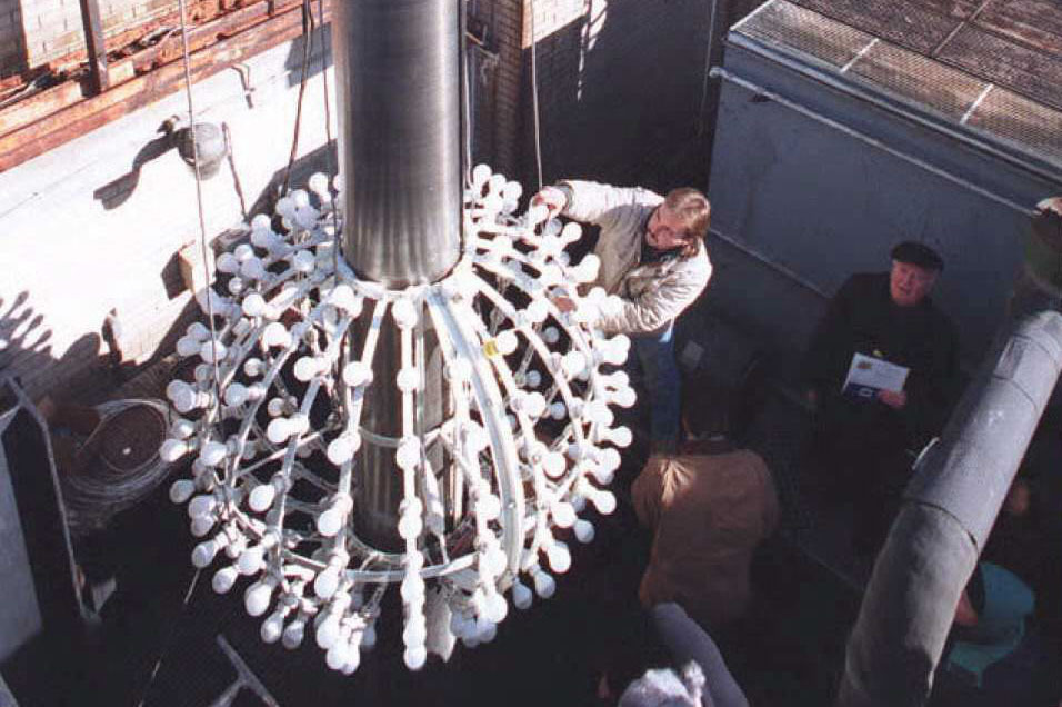 Technicians replace bulbs on the ball. This was the last appearance of the ball in this form before it was upgraded with aluminum skin and rhinestones in 1995.