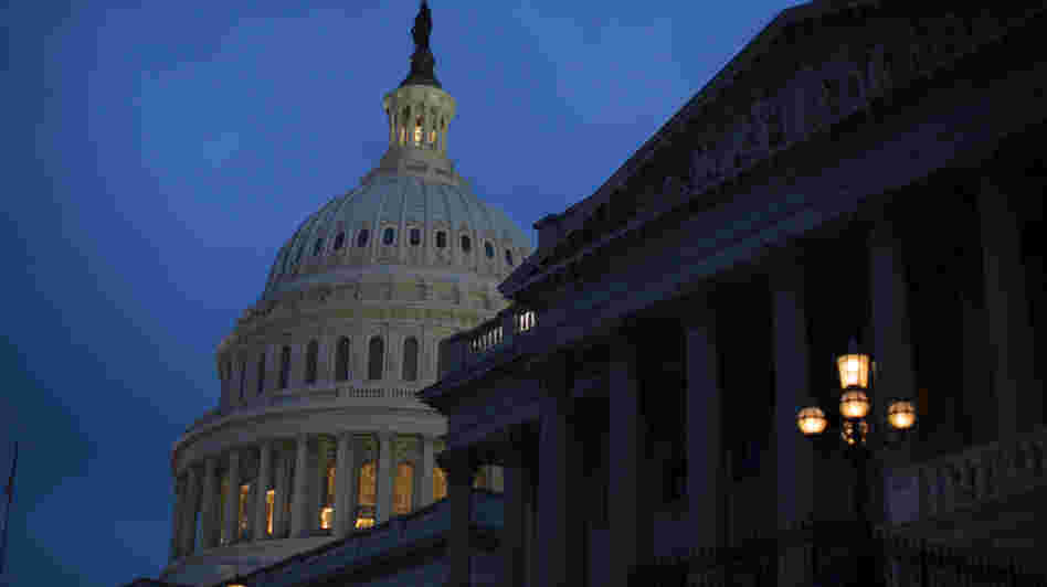 The Capitol is illuminated in Washington, where the House and Senate remain in session. The two chambers will miss a deadline to avoid the "fiscal cliff" tonight, as 2013 begins.