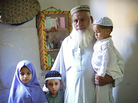 Gul Mohammed Khan has lost three sons in sectarian violence during the last two years, in Karachi, Pakistan. He stands here with some of his grandchildren who have lost their fathers. When he looks at his grandchildren, he says, he sees his sons. Gul Mohammed Khan has lost three sons in sectarian violence during the last two years, in Karachi, Pakistan. He stands here with some of his grandchildren who have lost their fathers. When he looks at his grandchildren, he says, he sees his sons.