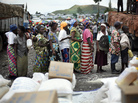 Congolese women wait for food to be distributed at the Mugunga III camp for displaced people outside the eastern town of Goma on Dec. 2. Congolese women wait for food to be distributed at the Mugunga III camp for displaced people outside the eastern town of Goma on Dec. 2.