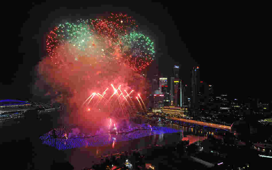 Fireworks illuminate the sky over the Marina Bay in Singapore during an eight-minute display.