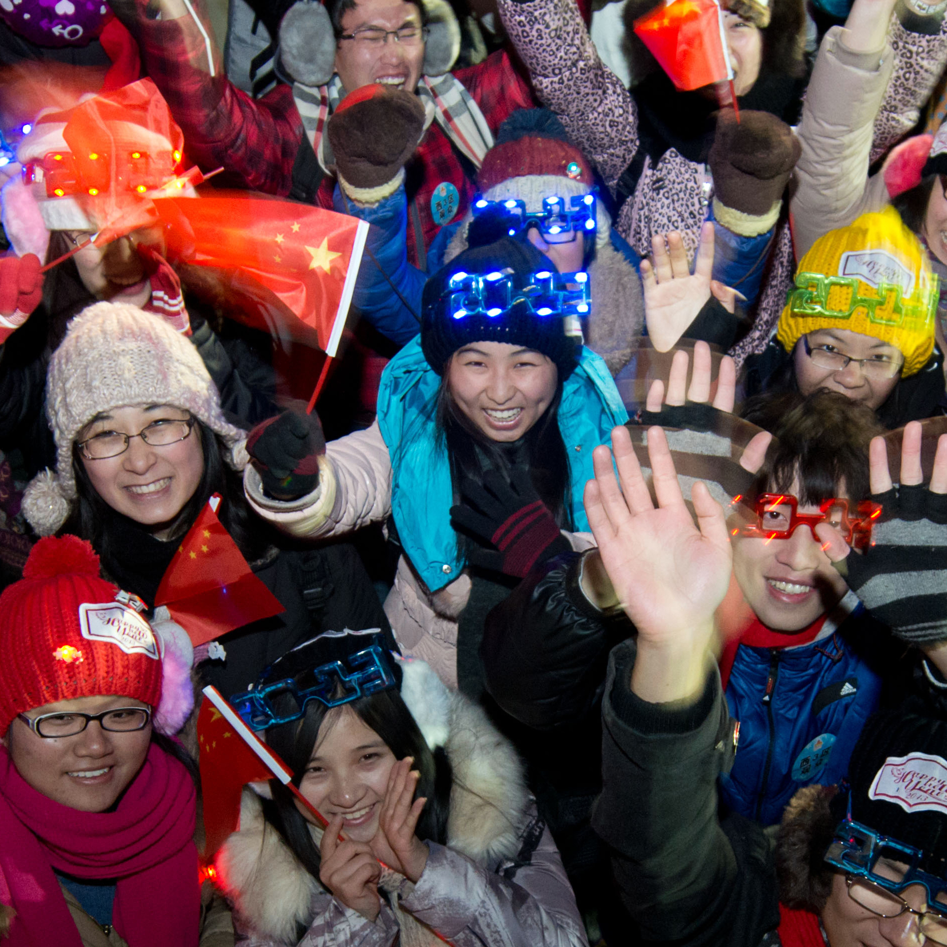 People celebrate the new year following a count-down event at the Summer Palace in Beijing.