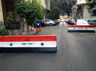 Regime barricades block a street in Damascus, Syria, on New Year's Eve. Regime barricades block a street in Damascus, Syria, on New Year's Eve.