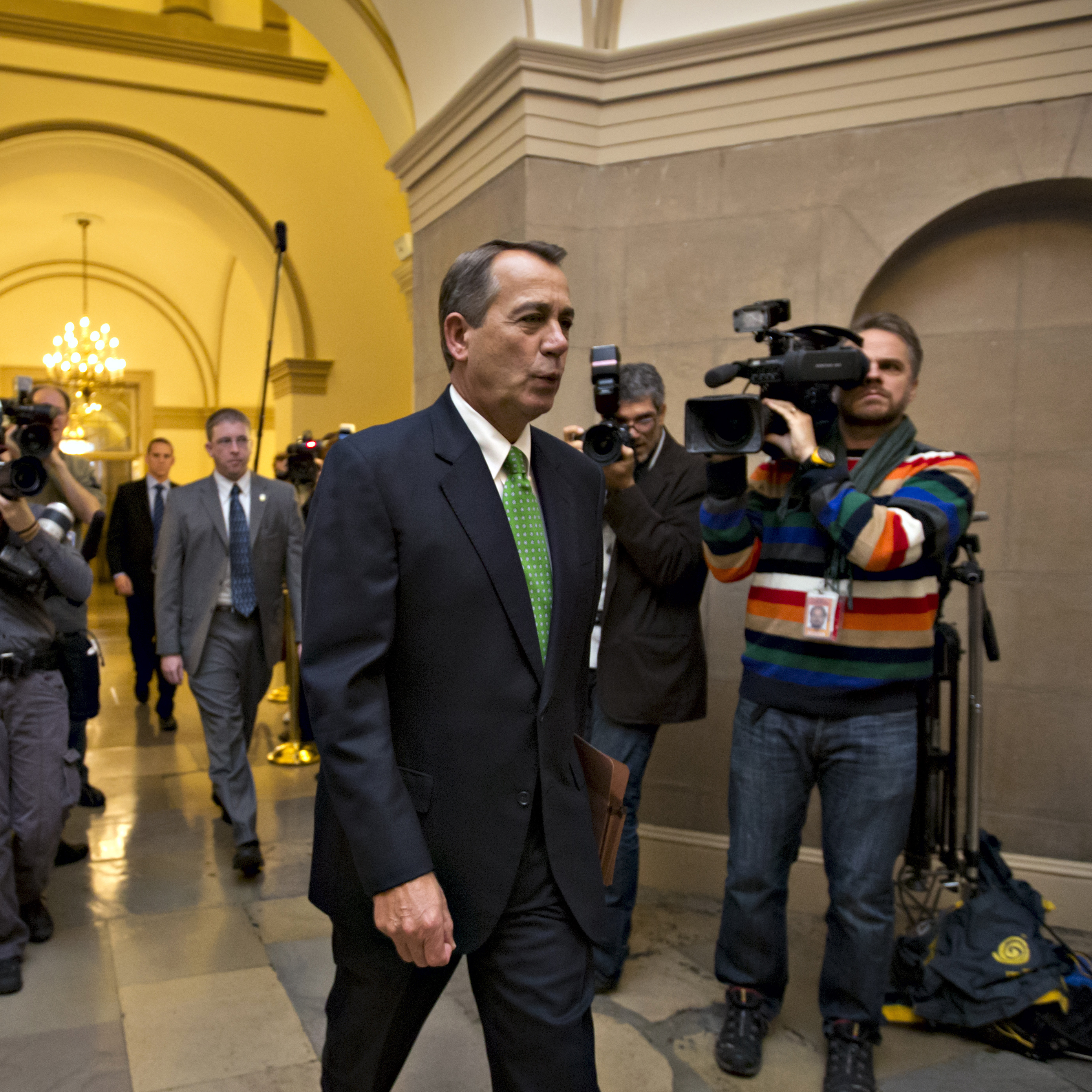 House Speaker John Boehner of Ohio arrives on Capitol Hill on Tuesday as legislation to negate a fiscal cliff of across-the-board tax increases and sweeping spending cuts moves to the GOP-dominated House.