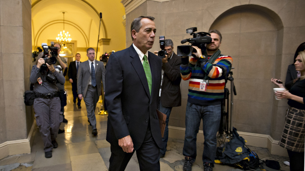 House Speaker John Boehner of Ohio arrives on Capitol Hill on Tuesday as legislation to negate a fiscal cliff of across-the-board tax increases and sweeping spending cuts moves to the GOP-dominated House.