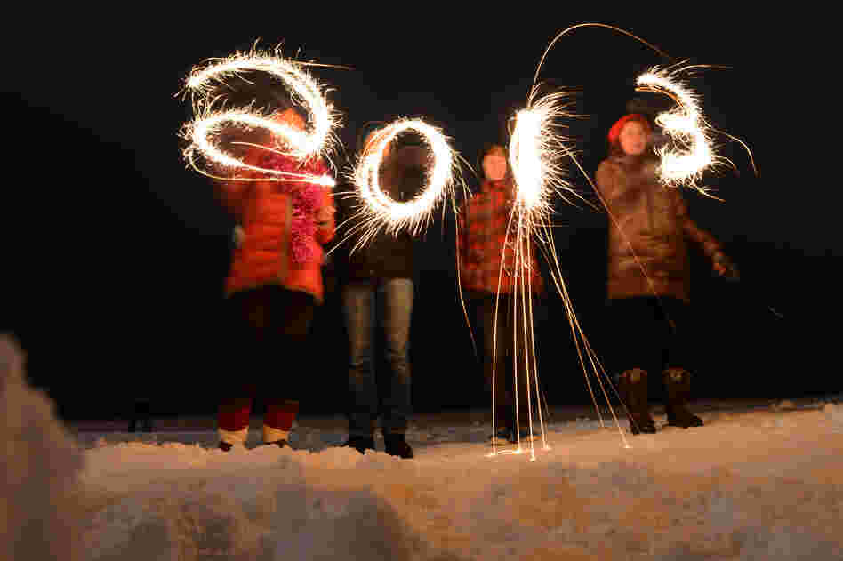 People write "2013" with sparklers as they celebrate the New Year at the shore of the Gulf of Finland in the city of Zelenogorsk.