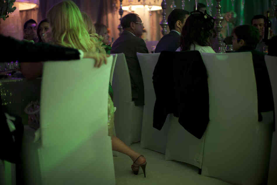 People attend a 2011 New Year's party catering to the upper crust of Israel's Russian-speaking immigrant community, in Tel Aviv.