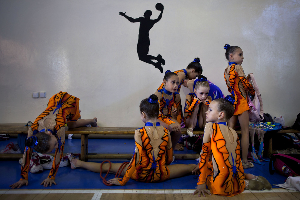 Gymnasts from Russian-speaking immigrant families warm up at a gymnastics competition organized for Israel's immigrant community, in the southern resort city of Eilat. Most of Israel's Olympic gymnasts are immigrants from the former Soviet Union.