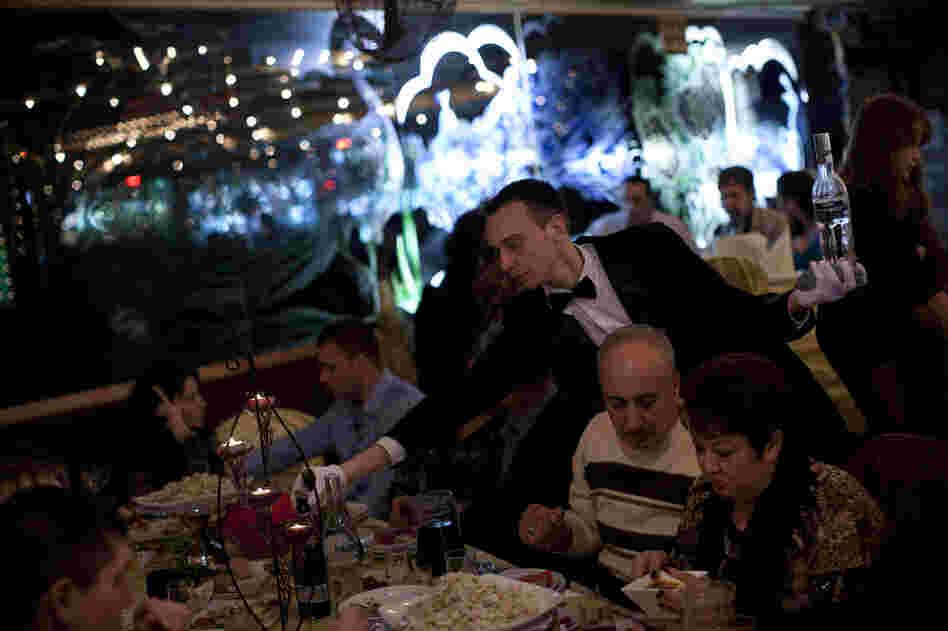 A waiter serves traditional Russian food at a seaside restaurant in Ashdod, a southern Israeli city heavily populated by immigrants from the former Soviet Union.