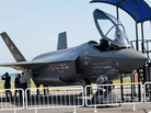 Visitors look at a Lockheed Martin F-35 fighter jet at the Singapore Airshow in 2010. The cost of the plane keeps on rising and is now $130 million or more per plane, depending on the model. Visitors look at a Lockheed Martin F-35 fighter jet at the Singapore Airshow in 2010. The cost of the plane keeps on rising and is now $130 million or more per plane, depending on the model.