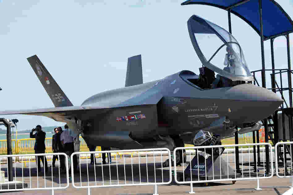 Visitors look at a Lockheed Martin F-35 fighter jet at the Singapore Airshow in 2010. The cost of the plane keeps on rising and is now $130 million or more per plane, depending on the model.