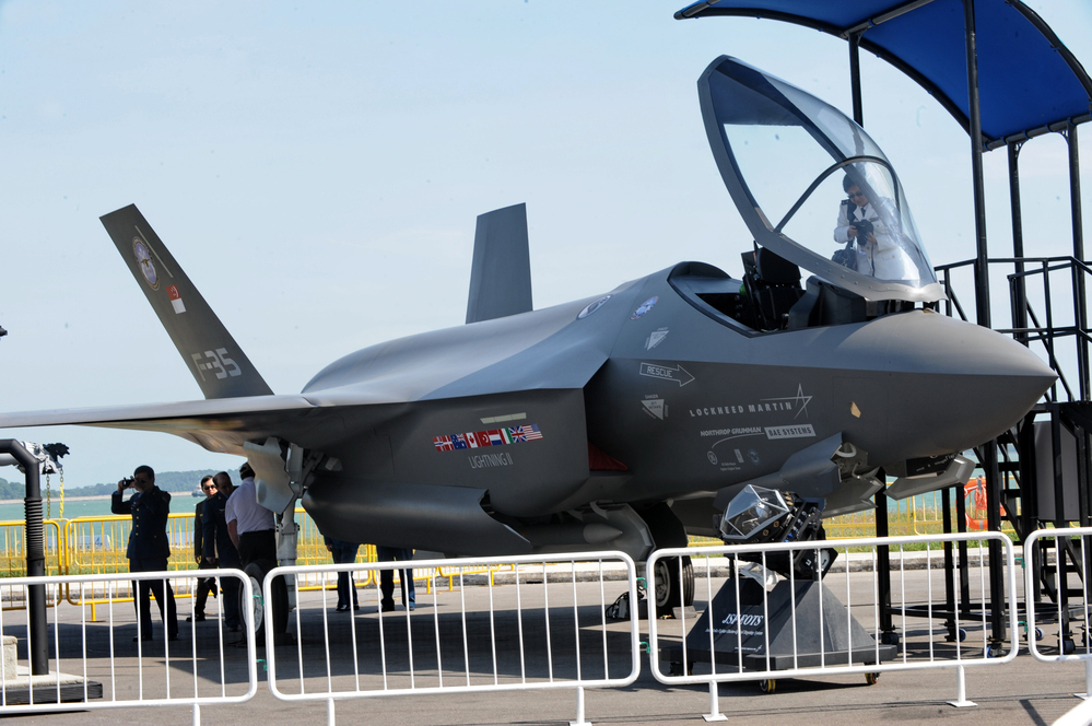 Visitors look at a Lockheed Martin F-35 fighter jet at the Singapore Airshow in 2010. The cost of the plane keeps on rising and is now $130 million or more per plane, depending on the model.