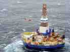 A Coast Guard helicopter crew conducts the 13th hoist of 18 crewmen from the mobile drilling unit Kulluk on Saturday, Dec. 29, 2012, 80 miles southwest of Kodiak City, Alaska. On Monday, the Kulluk ran aground on Sitkalidak Island.