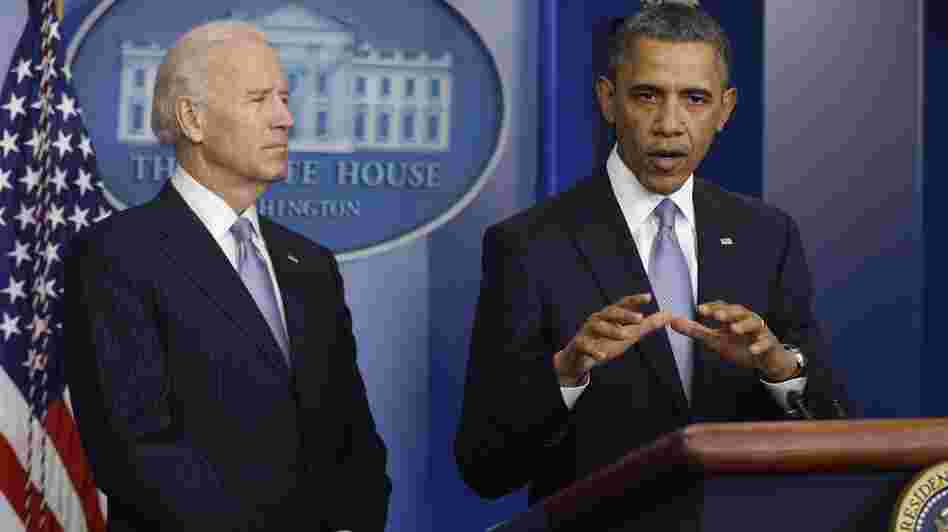President Barack Obama and Vice President Joe Biden make a statement regarding the passage of the fiscal cliff bill in the Brady Press Briefing Room at the White House late Tuesday evening.