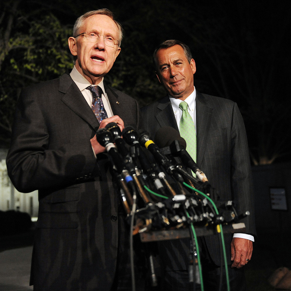 House Speaker John Boehner (right) and Senate Majority Leader Harry Reid at the White House in April 2011. Last week, they weren't so chummy.