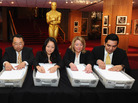 Accountants from PricewaterhouseCoopers prepare ballots for last year's Oscars mailing. Glitches in a new online voting system have prompted organizers to push back this year's balloting deadline. Accountants from PricewaterhouseCoopers prepare ballots for last year's Oscars mailing. Glitches in a new online voting system have prompted organizers to push back this year's balloting deadline.