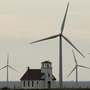 Wind turbines dwarf a church near Wilson, Kan. Although Congress voted to extend a wind energy tax credit, the temporary uncertainty dealt a blow to the industry. Wind turbines dwarf a church near Wilson, Kan. Although Congress voted to extend a wind energy tax credit, the temporary uncertainty dealt a blow to the industry.
