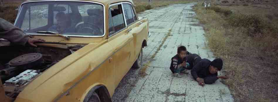 Vasily and Erasu Sokolov wait for their friends' car to be fixed while they are heading to the city.