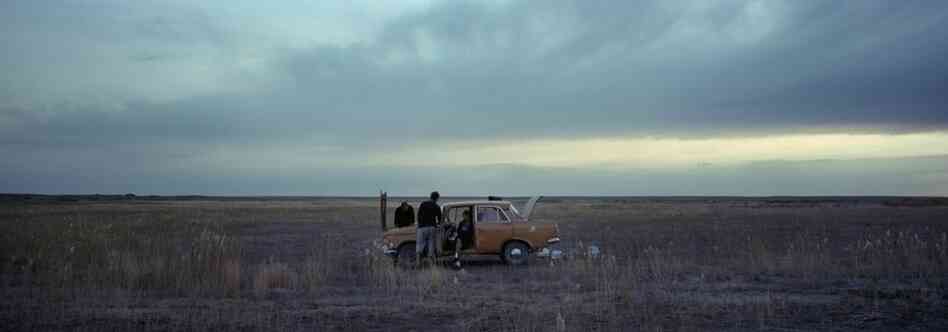 Tanya Sokolov and her friends try to fix a car on the steppe outside the city of Priozersk in the Sary-Shagan polygon, a former site for Soviet ballistic-missile testing in Kazakhstan, 2011. Tanya and her family live in an abandoned military barracks outside the city.