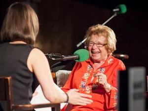 Host Ophira Eisenberg chats with this week's Ask Me Another Very Important Puzzler, Dr. Ruth Westheimer, on stage at The Bell House in Brooklyn, NY. Host Ophira Eisenberg chats with this week's Ask Me Another Very Important Puzzler, Dr. Ruth Westheimer, on stage at The Bell House in Brooklyn, NY.