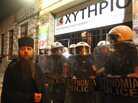 A Greek Orthodox priest is blocked by riot police as he takes part in a protest outside an Athens theater in October. The play, Corpus Christi, portrays Jesus and his apostles as gay men living in modern-day Texas. The director and the cast have been charged under Greece's blasphemy laws. A Greek Orthodox priest is blocked by riot police as he takes part in a protest outside an Athens theater in October. The play, Corpus Christi, portrays Jesus and his apostles as gay men living in modern-day Texas. The director and the cast have been charged under Greece's blasphemy laws.