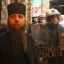 A Greek Orthodox priest is blocked by riot police as he takes part in a protest outside an Athens theater in October. The play, Corpus Christi, portrays Jesus and his apostles as gay men living in modern-day Texas. The director and the cast have been charged under Greece's blasphemy laws. A Greek Orthodox priest is blocked by riot police as he takes part in a protest outside an Athens theater in October. The play, Corpus Christi, portrays Jesus and his apostles as gay men living in modern-day Texas. The director and the cast have been charged under Greece's blasphemy laws.
