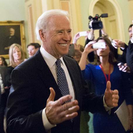 Vice President Joe Biden arrives for a closed-door meeting with Senate Democrats to urge them to support a fiscal cliff deal on Monday.