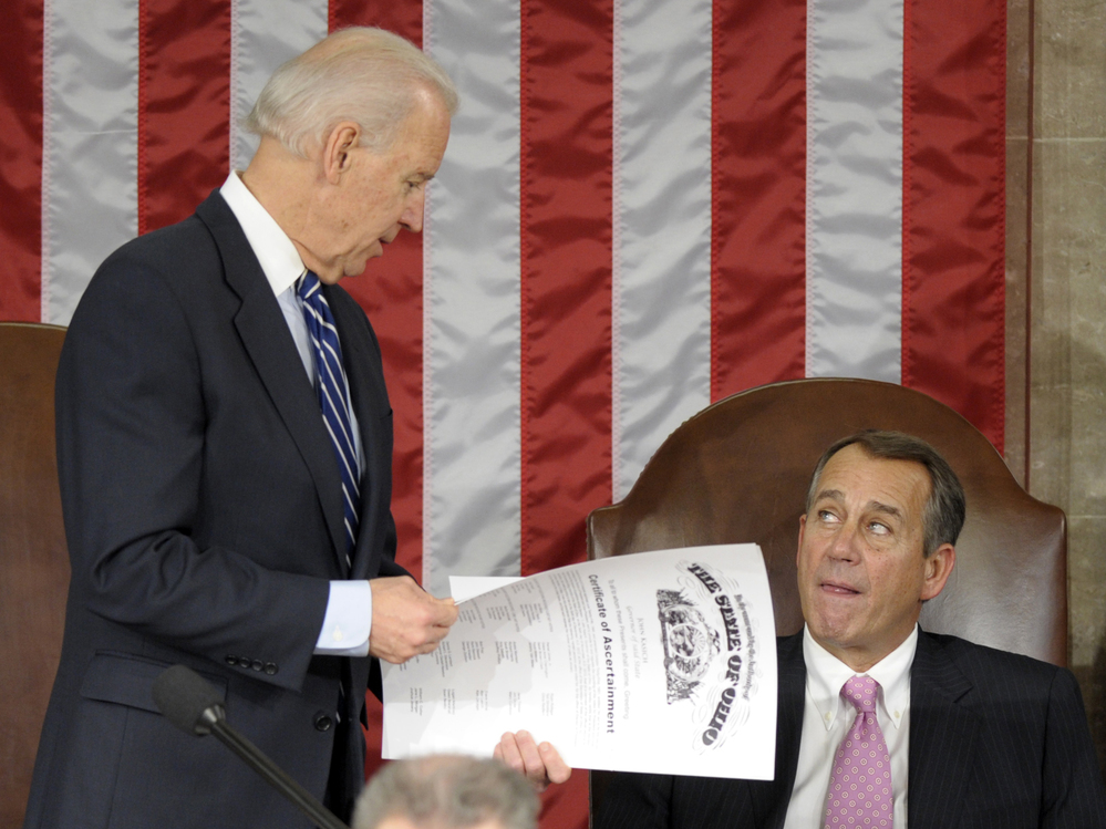 Vice President Joe Biden shows the certificate of the Electoral College vote for Ohio to House Speaker John Boehner during a joint session of Congress on Friday.