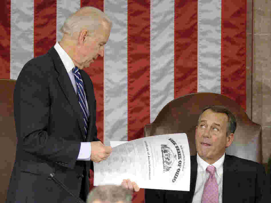Vice President Joe Biden shows the certificate of the Electoral College vote for Ohio to House Speaker John Boehner during a joint session of Congress on Friday.