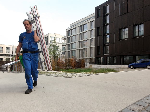 A worker walks through a new housing complex in Berlin. German and foreign investors are rapidly buying up property, leaving some analysts concerned about a potential housing bubble.