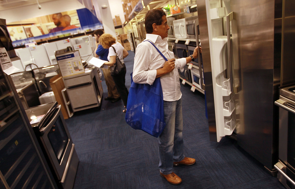 Ruben Fragoso checks out appliances at Best Buy in Miami in April 2010, when Florida residents were taking advantage of a federally funded discount for Energy Star-rated appliances. Legislation just passed by Congress as part of the fiscal-cliff deal includes tax breaks for energy-efficient appliances.