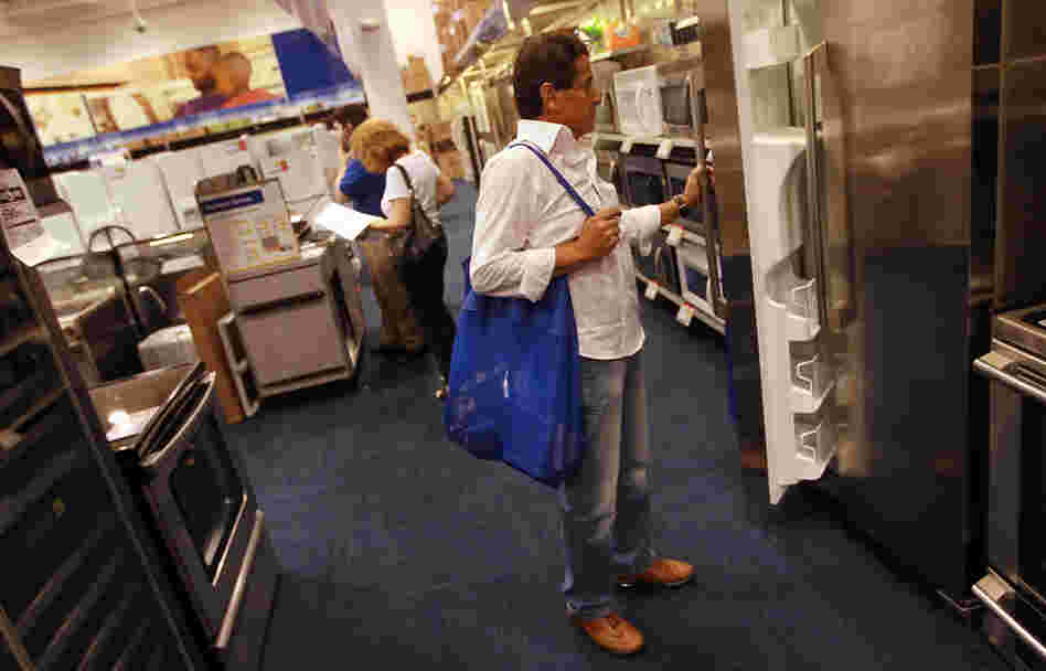 Ruben Fragoso checks out appliances at Best Buy in Miami in April 2010, when Florida residents were taking advantage of a federally funded discount for Energy Star-rated appliances. Legislation just passed by Congress as part of the fiscal-cliff deal includes tax breaks for energy-efficient appliances.
