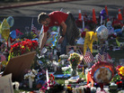 John Underhill waters flowers at a makeshift memorial for shooting victims outside the University Medical Center in Tucson, Ariz., on Jan. 20, 2011. Many of the plants and flowers at area memorials were replanted at a community garden. John Underhill waters flowers at a makeshift memorial for shooting victims outside the University Medical Center in Tucson, Ariz., on Jan. 20, 2011. Many of the plants and flowers at area memorials were replanted at a community garden.