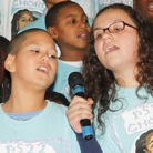 Group of kids singing. Group of kids singing.