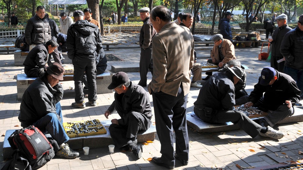 South Korean men play games at a downtown park in Seoul on Nov. 1. Recent data suggest that South Korea is now the fastest-aging country on Earth.