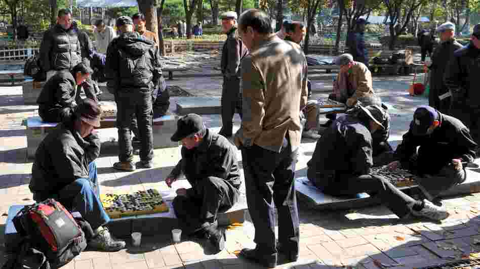 South Korean men play games at a downtown park in Seoul on Nov. 1. Recent data suggest that South Korea is now the fastest-aging country on Earth.