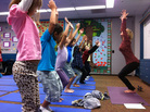 Third-graders at Olivenhain Pioneer Elementary School in Encinitas, Calif., perform chair pose with instructor Kristen McCloskey last month. Third-graders at Olivenhain Pioneer Elementary School in Encinitas, Calif., perform chair pose with instructor Kristen McCloskey last month.