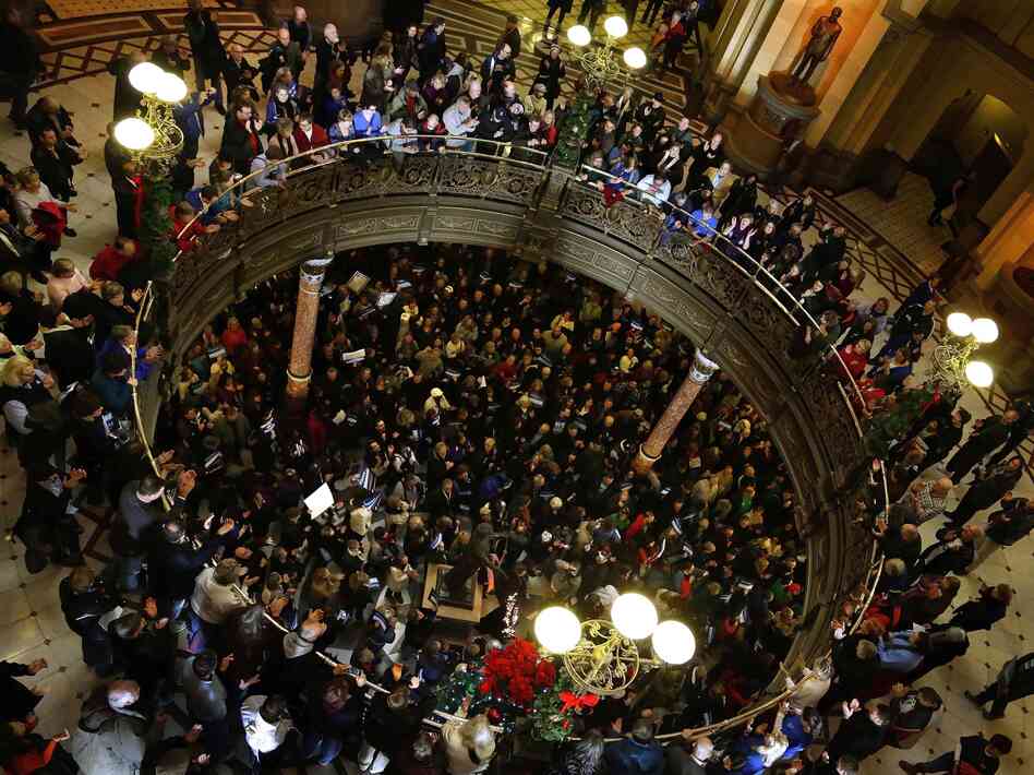 Illinois union members and supporters rally at the state Capitol on Thursday against legislation that would try to control the state's pension-fund shortfall by, in part, reducing pension benefits.