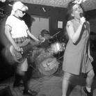 Bikini Kill performs in Washington, D.C., in the 1990s. Bikini Kill performs in Washington, D.C., in the 1990s.
