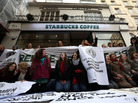 Protesters demonstrate outside a Starbucks coffee shop in London last month. Protests were held at Starbucks throughout the U.K. after it was revealed that the coffee chain had paid almost no corporate taxes for the last three years. Protesters demonstrate outside a Starbucks coffee shop in London last month. Protests were held at Starbucks throughout the U.K. after it was revealed that the coffee chain had paid almost no corporate taxes for the last three years.