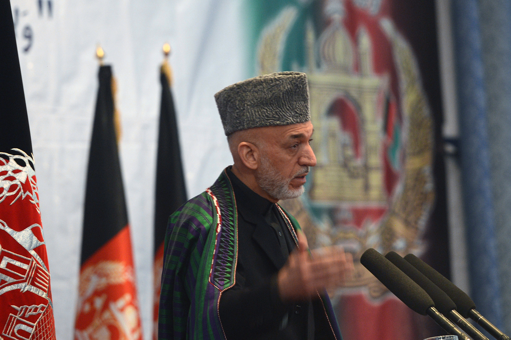 Afghan President Hamid Karzai will meet with President Obama and other senior U.S. officials in Washington this week. Many analysts remain skeptical about the prospects for a negotiated peace in Afghanistan. He's shown here speaking in Kabul last month.