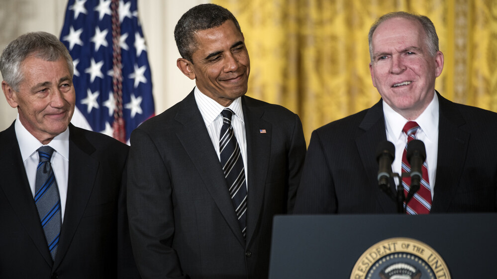 John Brennan speaks in the East Room of the White House on Monday, after President Obama announced his nomination of Brennan to run the CIA. Obama also announced his choice of former Sen. Chuck Hagel (left) to head the Department of Defense.
