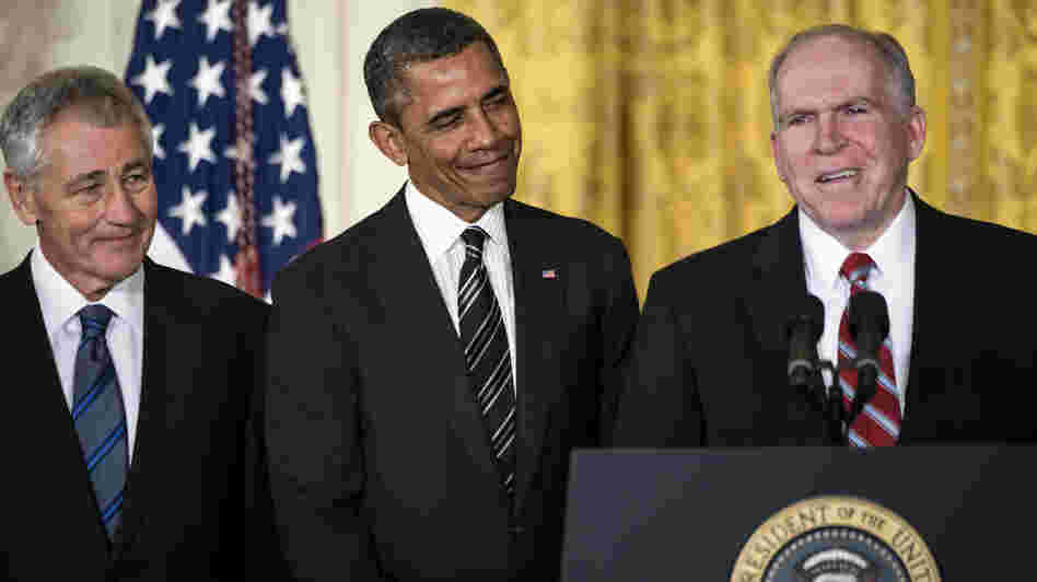 John Brennan speaks in the East Room of the White House on Monday, after President Obama announced his nomination of Brennan to run the CIA. Obama also announced his choice of former Sen. Chuck Hagel (left) to head the Department of Defense.