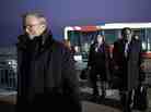 Google's Executive Chairman Eric Schmidt (left) arrives at Pyongyang International Airport on Monday. There is speculation that Schmidt's presence in North Korea could have an upside for Google by positioning Schmidt as the company's global ambassador.